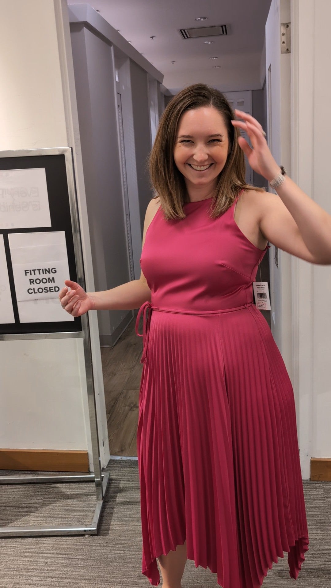 Woman smiling while receiving personal shopping and styling guidance from an Ottawa personal stylist.